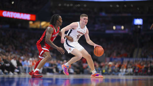 Isaac McKneely handles the ball during the Virginia men's basketball game against NC State in the semifinals of the 2024 ACC Men's Basketball Tournament at Capital One Arena.